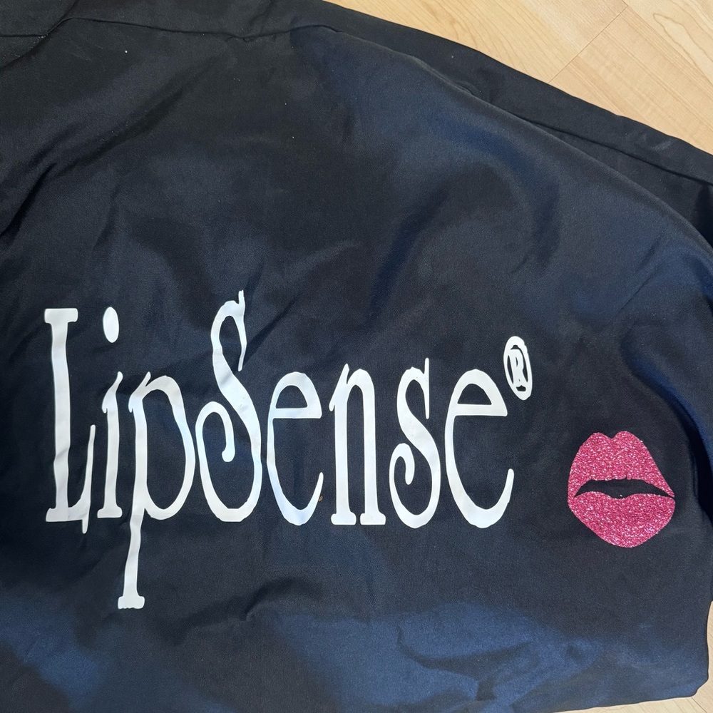 Custom Black tablecloth with LipSense logo for events. Fits 6 ft table